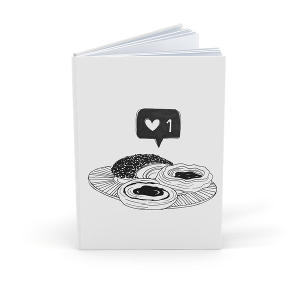 A5 Hardcover Journal — Black & White Pastry Illustration with "1" Social Like Icon